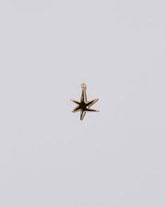 Verve Six Point Star Charm on light color background. Wide Necklace, Solid Gold Charms, Gold Charms, Colorless Diamond, Gold Alloys, Stud Set, Colored Gems, Diamonds And Gold, Solid Gold Jewelry