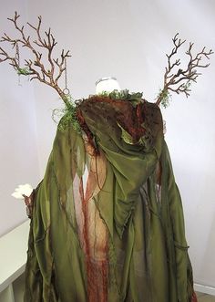 a dress made out of branches and fabric