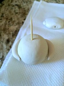 an odd looking object is sitting on a napkin with a toothpick sticking out of it