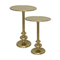 two gold colored metal tables with round bases on each side, set against a white background