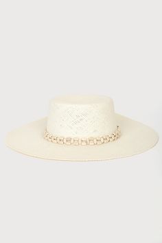 Enjoy the view of the ocean waves with the Lulus Beach Daze Cream Beaded Boater Hat! This cute sun hat is composed of lightweight, woven paper that shapes a boater silhouette with a high crown, flat top, and a wide floppy brim. Smooth wood-look beads accent the band for a vacay feel! 4" brim. 23" interior circumference with internal drawstring. 100% Paper. Gentle Wash. Hang Dry. Imported. Lulus | Beach Daze Cream Beaded Boater Hat. White Toquilla Straw Hat Band For Beach, Elegant Vacation Straw Hat Made Of Paper Straw, Elegant Paper Straw Hat For Vacation, Elegant Braided Straw Hat For Beach, Braided Straw Boater Hat With Flat Brim, White Straw Hat For Spring With Flat Crown, White Flat Crown Sun Hat For Spring, Beachy Straw Boater Hat With Flat Brim, Beach Season Short Brim Boater Hat