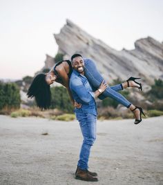 a man holding a woman on his back