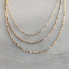 "The perfect simple chain, wear alone or with your favorite pendant.  These dainty necklaces are available in three styles in 14kt gold filled or sterling silver in your choice of length. D E T A I L S *ONE necklace in your choice of style, metal and length  *100% 14kt Gold-Filled or Sterling Silver LENGTH *Please select from the drop down selection. *The standard length is normally 18\". *Model is wearing 16-18-20\" in Photos. HOW TO PERSONALIZE *Select your choices from the drop down menu to create your custom design. ∙ EXTRA LOVE ∙ Handcrafted just for you in sunny Arizona by a team of talented women. All of our jewelry comes gift packaged! We are happy to leave a note if this is a special gift, just let us know in the message box at checkout. PRODUCTION ∙ TIMES All items are made to or Dainty Gold Layered Necklace With Cable Chain, Dainty Layered Cable Chain Necklace For Gifts, Simple Gold Layered Necklace As Gift, Simple Gold Layered Necklace For Gift, 14k Gold Delicate Chain Layered Necklace Gift, 14k Gold Layered Necklace As Gift, Gold Necklace Dainty, Simple Chain Necklace, Dainty Gold Jewelry