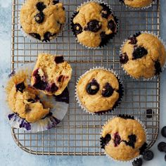 several blueberry muffins on a cooling rack