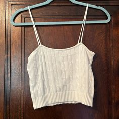 White Tank Top. No Flaws. Never Worn. One Size. White Cropped Knit Tank Top, Brandy Melville Tank Top, Brandy Melville Tank, Brandy Melville Tops, Brandy Melville, White Tank, White Tank Top, White Tops, Womens Tops