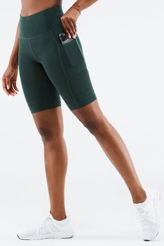 High-Waisted SculptKnit® Pocket Short Fabletics green female Activewear >> Womens >> Bottoms >> Shorts SculptKnit regular Training Breathable/Chafe-Resistant/Moisture-Wicking/Pockets Green Breathable Athleisure Bottoms, Green Functional Yoga Bottoms, Versatile Green Sports Bottoms, Green Activewear For Gym With Elastic Waistband, Green Compression Sportswear Bottoms, Green Activewear With Elastic Waistband For Gym, Stretch Green Running Bottoms, Green Compression Running Bottoms, Sporty Compression Green Bottoms