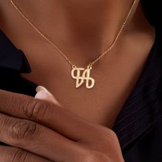 Personalize Your Style with Our Logo Name Necklace. Crafted with precision and attention to detail, this necklace is the perfect way to showcase your personal style. Metal: Stainless Steel Available in a variety of finishes: 🌹 Rose Gold 🟡 18k Gold 🥈 Silver 🌹 Iced Rose Gold + 💎 Cubic Zirconia 🟡 Iced 18k Gold + 💎 Cubic Zirconia 🥈 Iced Silver + 💎 Cubic Zirconia The chain length options include: - 16" - 18" - 20" - 22" Each necklace is meticulously: ✨ Designed ✨ Polished ✨ Assembled Please note: All our items come with a 5 cm/2" extension chain. so don't hesitate about the size!! * 14" NECKLACE: Fits most like a choker * 16" NECKLACE: Falls perfectly around the base of the neck like a collar. On a petite woman it will hit your collarbone while for plus size women it might feel more li Formal Initial Pendant Necklace, Formal Initial Pendant Charm Necklace, Gold Engraved Custom Necklace As A Gift For Her, Custom Engraved Gold Necklace For Her, Gold Pendant Initial Necklace As Gift For Her, Dainty Initial Necklace For Formal Occasions, Gold Engraved Necklace As Gift For Her, Gold Chain Necklace With Initials For Gift, Gold Initial Pendant Necklace For Personalized Gift