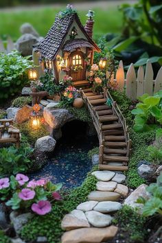 a miniature garden with steps leading up to a small house in the middle of it