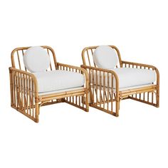 pair of bamboo chairs with white cushions on the back and sides, side by side