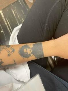 a person with a tattoo on their arm