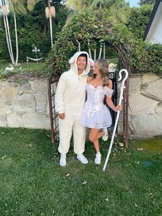 a man and woman in bunny costumes standing next to each other