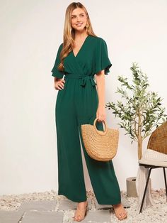 This sublime Butterfly Sleeve V Neck Wide Leg Jumpsuit is the perfect choice for an undeniably chic look. Featuring beautiful butterfly sleeves and a wide-leg design crafted from a vibrant green fabric with a knot tie in front to flatter your figure, this luxury jumpsuit radiates sophistication and stylish elegance. Features: Style: Elegant Pattern Type: Plain Type: Wide Leg Details: Belted, Wrap, Zipper Length: Long Fit Type: Regular Fit Neckline: V neck Sleeve Length: Short Sleeve Sleeve Type: Chic Green V-neck Jumpsuit, Spring Green V-neck Jumpsuits And Rompers, Green V-neck Jumpsuits And Rompers For Spring, Green V-neck Jumpsuit For Work, Belted V-neck Jumpsuits And Rompers For Vacation, Elegant Short Sleeve Jumpsuits And Rompers For Vacation, Belted V-neck Jumpsuit For Vacation, V-neck Belted Jumpsuits And Rompers For Vacation, Green Short Sleeve Jumpsuits And Rompers For Summer