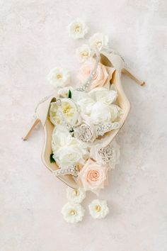 wedding shoes and flowers on the floor