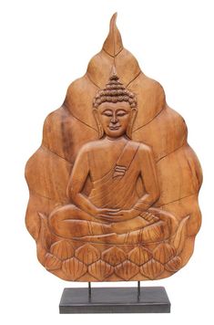 a carved buddha statue sitting on top of a wooden stand