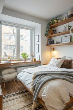 a bed sitting under a window next to a desk