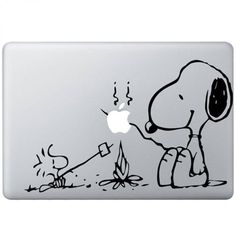 an apple laptop with a sticker of a snoopy dog and a campfire