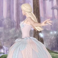 a woman in a pink and blue ball gown standing next to a forest with trees