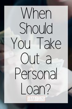 a person holding money with the words when should you take out a personal loan?