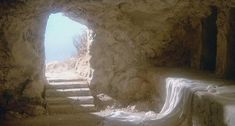 a stone tunnel with steps leading into it