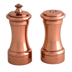 two copper salt and pepper shakers on a white background