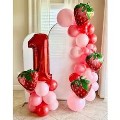 the number one is made out of balloons and strawberries