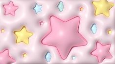 a pink and yellow star wallpaper with many different stars on the wall behind it