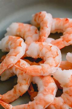 some shrimp is sitting in a bowl on the table