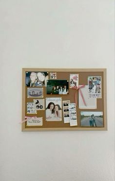 a cork board with pictures and magnets attached to it