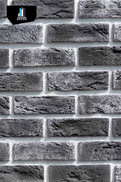 a black and white photo of a brick wall that has been made into a pattern