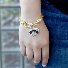 Our sparkling braided bracelet, equipped with a stylish lobster claw clasp and the Navy Blue Nana pave heart charm, is crafted from white metal with a gold plated finish and accented with cubic zirconia stones. Navy Blue Bridesmaids, Gold Class, Gold Candy, Black Banner, Blue Trainers, Braided Bracelet, Blue Bridesmaids, Lgbt Pride, Black Ribbon