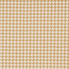 an orange and white pattern on fabric