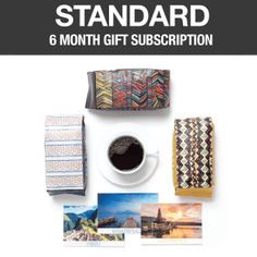 a coffee cup and other items on a table with the words standard 6 month gift subscription