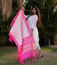 Celebrate any occasion in style with our silk blend patola dupatta. Crafted with care, each piece is elegant and unique. Enjoy the exclusivity of our limited edition collections and savor the slow fashion journey with us. Care: Consider dry cleaning or hand washing as preferable options, as machine washing may increase the likelihood of damaging the dupatta. Dupatta Length: Approx 2 meters * 0.5 metersUsage: Evening, Weddings, Festivals, Parties or any other special occasions.Perfect Gifting Solution: They also make ideal gifts for daughters, mothers, grandmothers, colleagues, partners, students, girlfriends, brides, bridesmaids, wives, wedding gifts, Ramadan, Eid gifts, Diwali Our soft and luxurious Patola cotton-silk dupatta, is perfect for any occasion. This dupatta is the perfect acces Luxury Dola Silk Dupatta With Pallu, Festive Off-white Handloom Dupatta, White Bandhani Print Dupatta In Traditional Drape, Slub Silk Dupatta With Zari Weaving, Cotton Silk Dupatta With Bandhani Print For Wedding, Festive White Dupatta With Bandhani Print, White Bandhani Print Dupatta, White Bollywood Dupatta With Bandhani Print, Diwali White Bandhani Print Dupatta