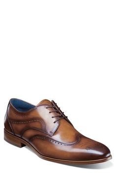 Burnished leather and traditional broguing enhance the silhouette of this wingtip shoe built with anatomic support and a flexible sole. Flexzone removable, cushioned insole with arch support Leather upper/synthetic lining/rubber sole Imported Fitted Wingtip Dress Shoes With Removable Insole, Semi-formal Wingtip Oxfords With Cushioned Footbed, Wingtip Dress Shoes With Cushioned Footbed, Semi-formal Wingtip Dress Shoes With Cushioned Footbed, Wingtip Shoes, Wingtip Oxford, Mens Oxfords, Arch Support, Rubber Sole