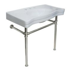 a white sink sitting on top of a metal stand