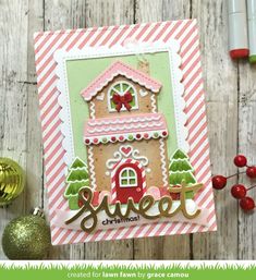 a christmas card with a gingerbread house