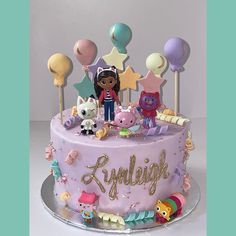 a birthday cake decorated with toys and decorations