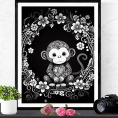 a black and white drawing of a monkey surrounded by flowers