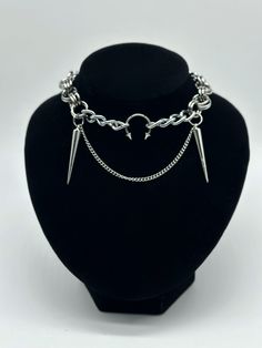 This Horseshoe + Spike Chain Mail Necklace is designed and pieced in our U.K. studio using durable steel and stainless steel materials. The lobster clasp fastening ensures a secure fit, while the 3 different lengths allow for versatility in styling options. Elevate any outfit with this edgy yet statement accessory.