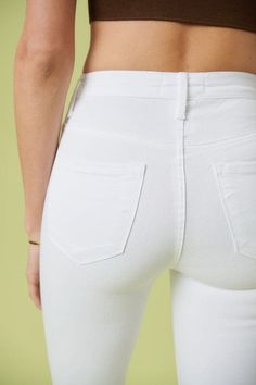 A pair of extreme flare jeans featuring a light distressed design, frayed raw hem, and ripped knee slits. These jeans offer two back patch pockets, faux front pockets, and a zip-fly closure. Rise: 11" Inseam: 34" Model is 5'11" and wearing a size 3 White Ripped Jeans, High Rise Flare Jeans, High Waisted Flares, Love Clothing, Edgy Look, Denim Flares, White Fashion, Sheer Fabrics, Modern Fashion