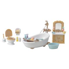 a toy bathtub with toys surrounding it on a white surface, including a sink and toilet