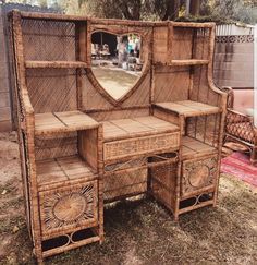 an old wooden desk with drawers and mirror on it's side in the yard