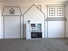 a kitchen with black and white lines painted on the wall next to a stove top oven