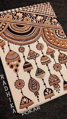 an intricately designed greeting card with the words radh kapokar on it