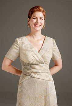 a woman in a dress posing for the camera