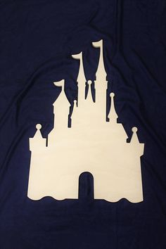 the silhouette of a castle is shown on a dark blue background with white outlines