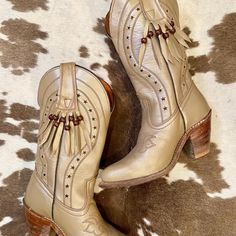 Vintage Miss Capezio Beige Metallic Leather Cowgirl Boots with Fringe Women's size 7.5 M They are in great vintage condition and adorable. Vintage sizes vary please use measurements. I take measurements with the boot against the wall in inches. Please ask any questions before purchasing. Miss Capezio  Size 7 1/2 M Heel to Toe: 10" Heel: 3" Height: 13" Ball:3 1/4" Vintage Beige Almond Toe Boots, Boots With Fringe, Leather Cowgirl Boots, Cowboy Western, Western Cowboy Boots, Metallic Leather, Cowgirl Boots, Western Cowboy, Boot Shoes Women