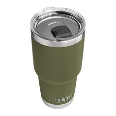 the yeti cup is made from stainless steel and has a green lid