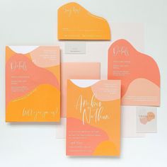 the wedding stationery is in peach, yellow and pink with modern calligraphy on it