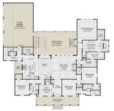 the first floor plan for a home with two master suites and an open kitchen area